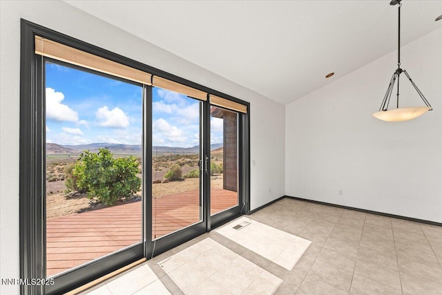 5455 Wild Horse Rd, Reno, NV 89510 - empty room featuring vaulted ceiling, a mountain view, and light tile patterned floors