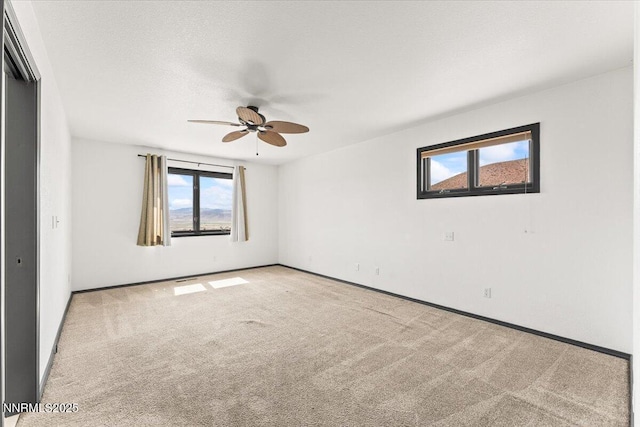 5455 Wild Horse Rd, Reno, NV 89510 - spare room featuring a ceiling fan, healthy amount of natural light, and carpet flooring
