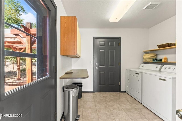 5455 Wild Horse Rd, Reno, NV 89510 - laundry area featuring independent washer and dryer, light tile patterned flooring, and cabinet space