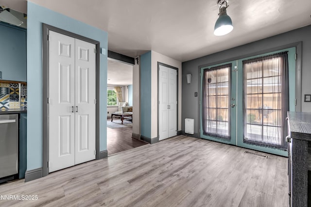 13250 Rolling Sage Pl, Reno, NV 89506 - unfurnished dining area featuring french doors and light wood finished floors