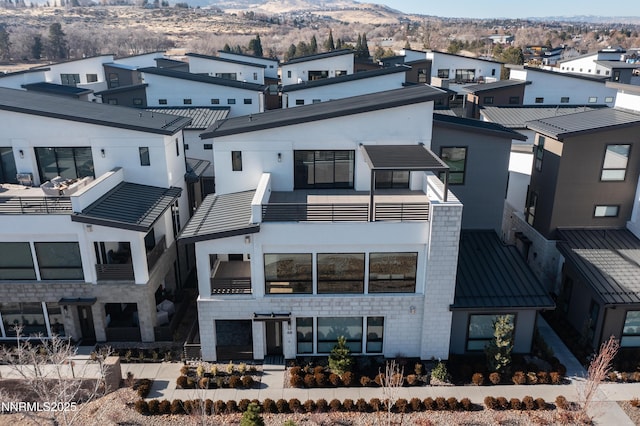 66 Caballada St, Reno, NV 89511 - view of building exterior with a mountain view and a residential view