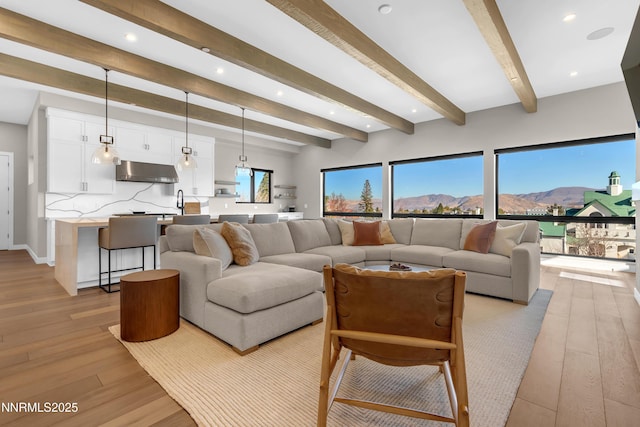 66 Caballada St, Reno, NV 89511 - living area with light wood-type flooring, beamed ceiling, recessed lighting, and a mountain view
