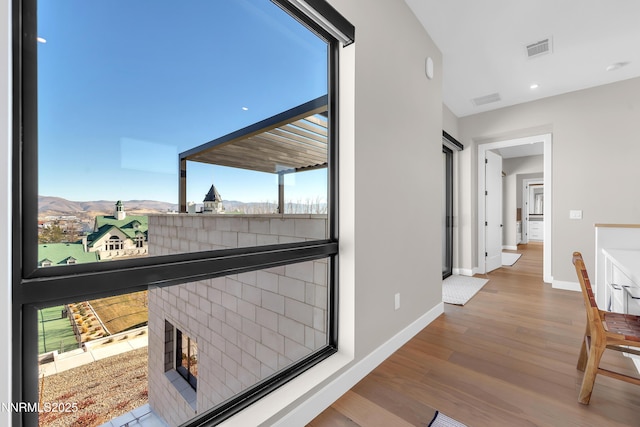 66 Caballada St, Reno, NV 89511 - hall featuring wood finished floors, a mountain view, and recessed lighting