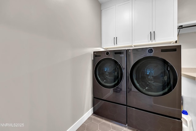 66 Caballada St, Reno, NV 89511 - laundry room featuring washing machine and clothes dryer, cabinet space, and tile patterned flooring