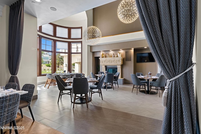 66 Caballada St, Reno, NV 89511 - dining space with a towering ceiling and a glass covered fireplace