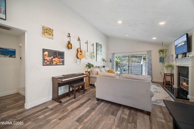 2787 Randolph Dr, Reno, NV 89502 - living area featuring wood finished floors, a glass covered fireplace, recessed lighting, and vaulted ceiling
