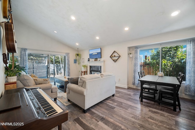 2787 Randolph Dr, Reno, NV 89502 - living area featuring dark wood finished floors, recessed lighting, vaulted ceiling, and a glass covered fireplace