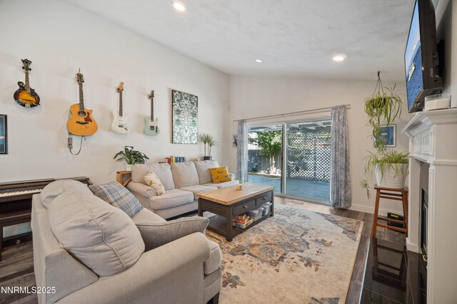 2787 Randolph Dr, Reno, NV 89502 - living area with lofted ceiling, recessed lighting, wood finished floors, and a fireplace