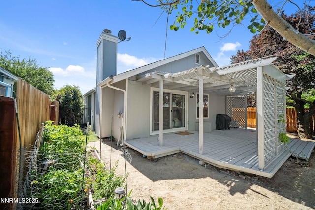 2787 Randolph Dr, Reno, NV 89502 - back of property featuring a pergola, a deck, a fenced backyard, and a chimney