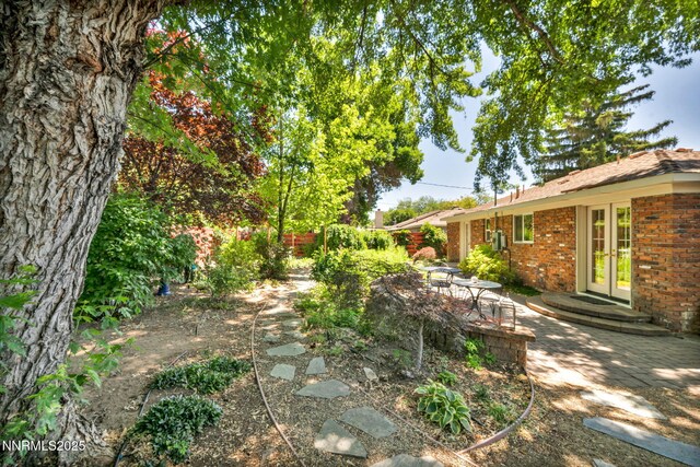 825 W 11th St, Reno, NV 89503 - view of yard with french doors and a patio