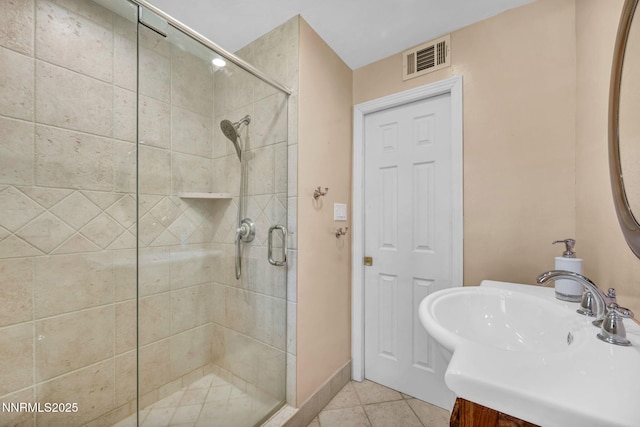 825 W 11th St, Reno, NV 89503 - bathroom featuring a stall shower, tile patterned flooring, and vanity