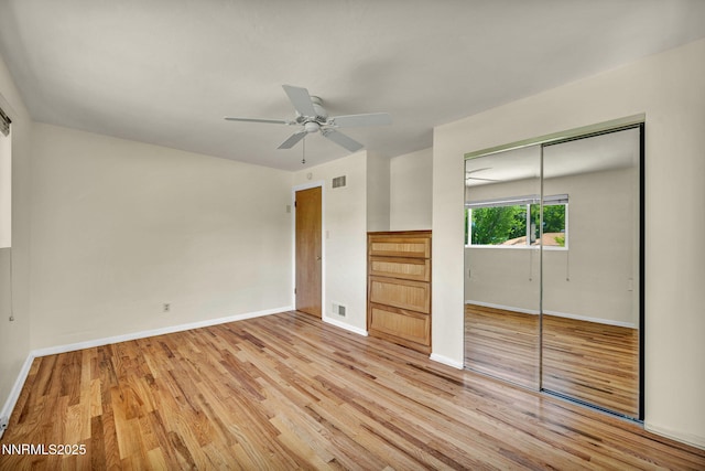 825 W 11th St, Reno, NV 89503 - unfurnished bedroom with wood finished floors, a closet, and a ceiling fan