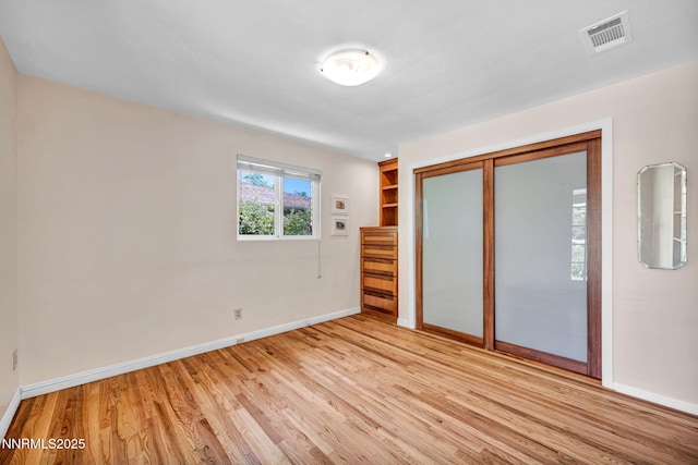 825 W 11th St, Reno, NV 89503 - unfurnished bedroom featuring light wood finished floors and a closet