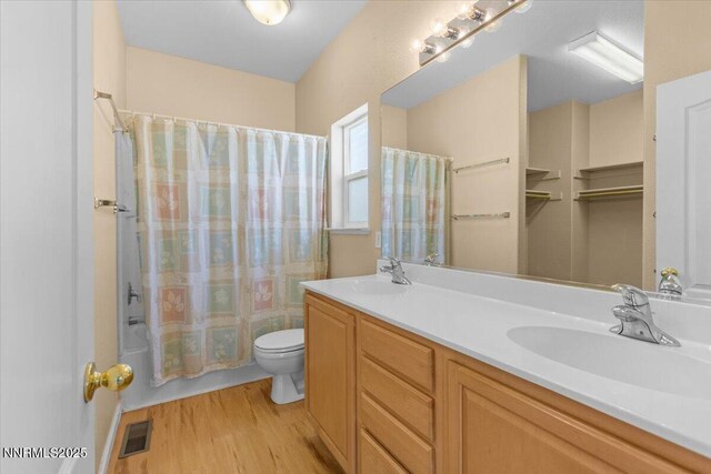 9732 Autumn Leaf Way, Reno, NV 89506 - bathroom with wood finished floors, double vanity, and shower / bath combination with curtain