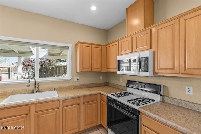 9732 Autumn Leaf Way, Reno, NV 89506 - kitchen featuring gas stove, white microwave, light countertops, recessed lighting, and light brown cabinets
