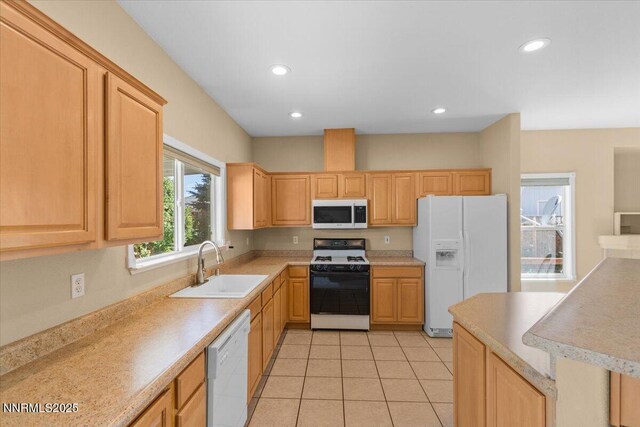 9732 Autumn Leaf Way, Reno, NV 89506 - kitchen with white appliances, recessed lighting, light countertops, light tile patterned floors, and light brown cabinets
