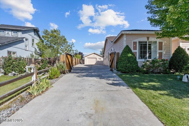 9732 Autumn Leaf Way, Reno, NV 89506 - view of property exterior featuring an outdoor structure, a garage, and driveway