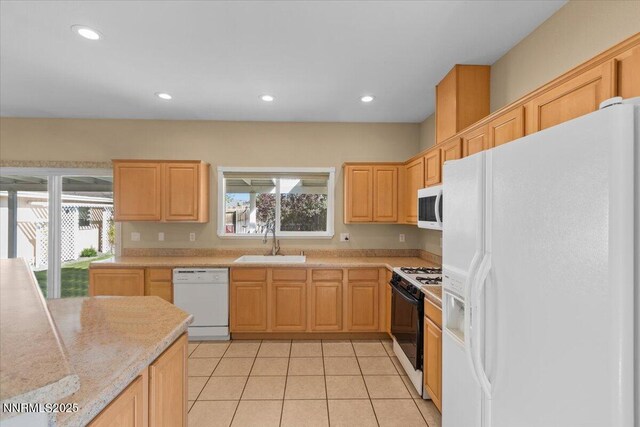 9732 Autumn Leaf Way, Reno, NV 89506 - kitchen featuring white appliances, light countertops, recessed lighting, light tile patterned floors, and plenty of natural light