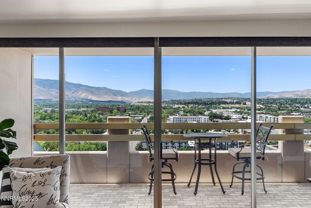 100 N Arlington Ave Unit 17G, Reno, NV 89501 - sunroom featuring a mountain view and plenty of natural light