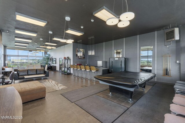 100 N Arlington Ave Unit 17G, Reno, NV 89501 - rec room featuring healthy amount of natural light, billiards table, a towering ceiling, and a heating unit