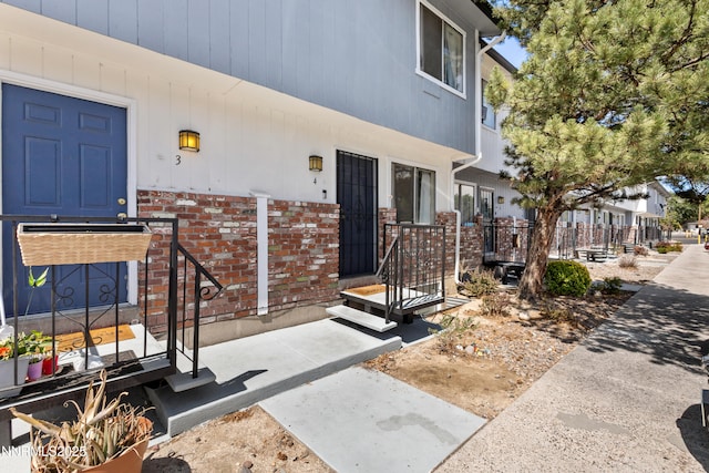 1414 E 9th St Unit 4, Reno, NV 89512 - doorway to property featuring brick siding
