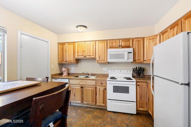 1414 E 9th St Unit 4, Reno, NV 89512 - kitchen with white appliances, light countertops, dark stone finish floors, and light brown cabinetry