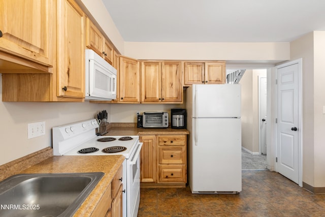 1414 E 9th St Unit 4, Reno, NV 89512 - kitchen featuring white appliances and light brown cabinets