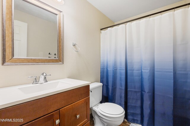 1414 E 9th St Unit 4, Reno, NV 89512 - bathroom featuring toilet and vanity