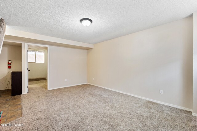 1414 E 9th St Unit 4, Reno, NV 89512 - carpeted spare room featuring a textured ceiling and baseboards