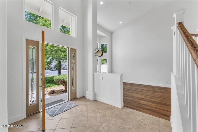 4413 Desert Hills Ct, Sparks, NV 89436 - entryway with high vaulted ceiling, light tile patterned floors, and recessed lighting