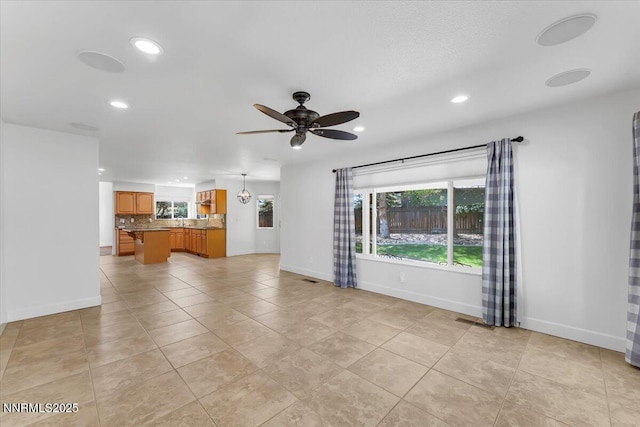 4413 Desert Hills Ct, Sparks, NV 89436 - unfurnished living room featuring recessed lighting, a ceiling fan, and light tile patterned floors