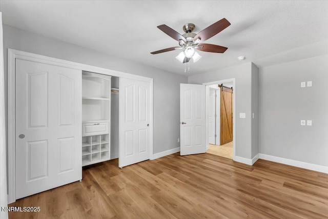 4413 Desert Hills Ct, Sparks, NV 89436 - unfurnished bedroom with wood finished floors, a closet, and a ceiling fan