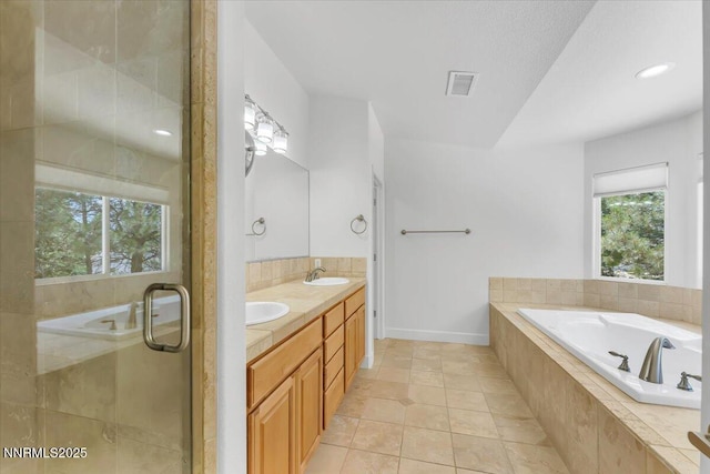 4413 Desert Hills Ct, Sparks, NV 89436 - bathroom with double vanity, a bath, a stall shower, and tile patterned flooring