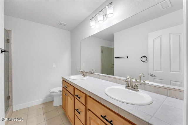 4413 Desert Hills Ct, Sparks, NV 89436 - full bathroom with double vanity, an enclosed shower, and tile patterned floors