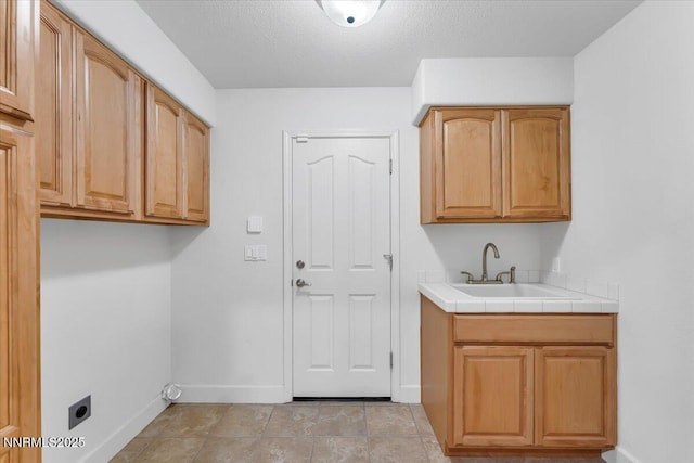 4413 Desert Hills Ct, Sparks, NV 89436 - laundry area featuring cabinet space, hookup for an electric dryer, and a textured ceiling
