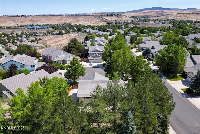 4413 Desert Hills Ct, Sparks, NV 89436 - aerial view of residential area featuring a mountainous background