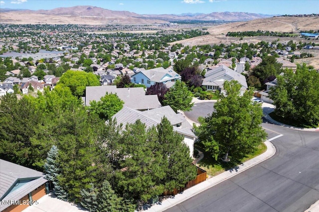 4413 Desert Hills Ct, Sparks, NV 89436 - aerial view of residential area featuring a mountainous background