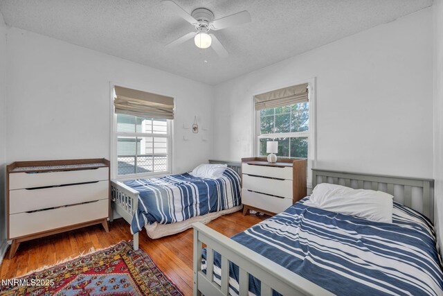 1725 Westfield Ave, Reno, NV 89509 - bedroom featuring a textured ceiling, wood-type flooring, and a ceiling fan
