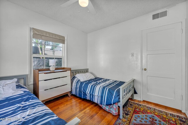 1725 Westfield Ave, Reno, NV 89509 - bedroom featuring a textured ceiling, wood-type flooring, and ceiling fan