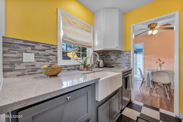 1725 Westfield Ave, Reno, NV 89509 - kitchen with tile patterned floors, a ceiling fan, dishwasher, light stone countertops, and tasteful backsplash
