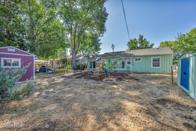 1725 Westfield Ave, Reno, NV 89509 - rear view of house featuring a storage shed, a playground, and board and batten siding