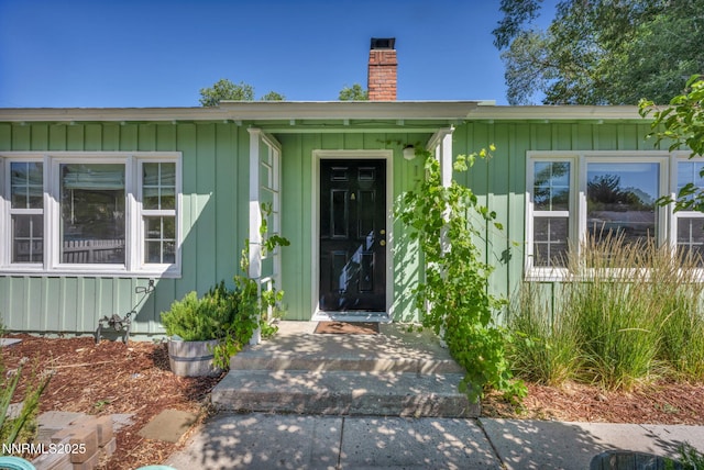 1725 Westfield Ave, Reno, NV 89509 - property entrance featuring a chimney and board and batten siding