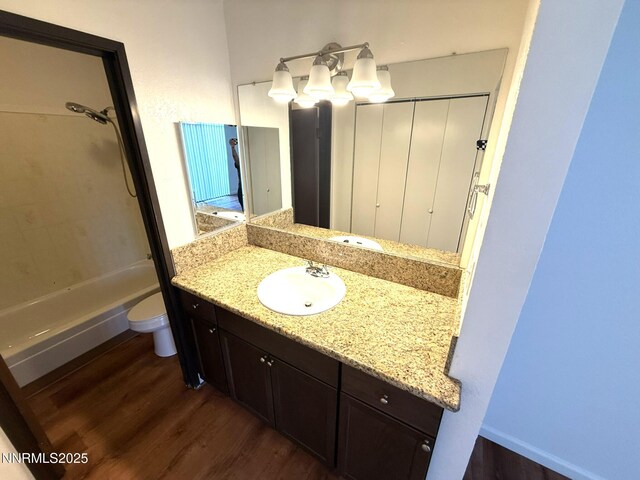 2450 Lymbery St Unit 219, Reno, NV 89509 - bathroom with wood finished floors, vanity, and shower / washtub combination
