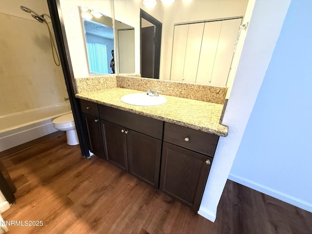 2450 Lymbery St Unit 219, Reno, NV 89509 - full bathroom featuring vanity, wood finished floors, and shower / washtub combination