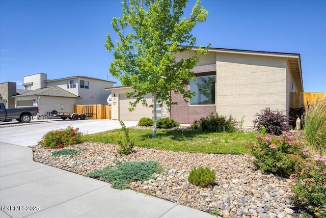 2251 Slater Mill Dr, Sparks, NV 89441 - view of front facade with concrete driveway, a garage, and stucco siding
