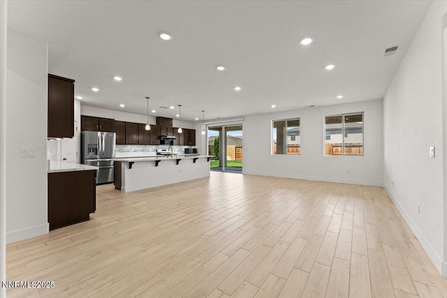 2251 Slater Mill Dr, Sparks, NV 89441 - unfurnished living room with recessed lighting and light wood finished floors