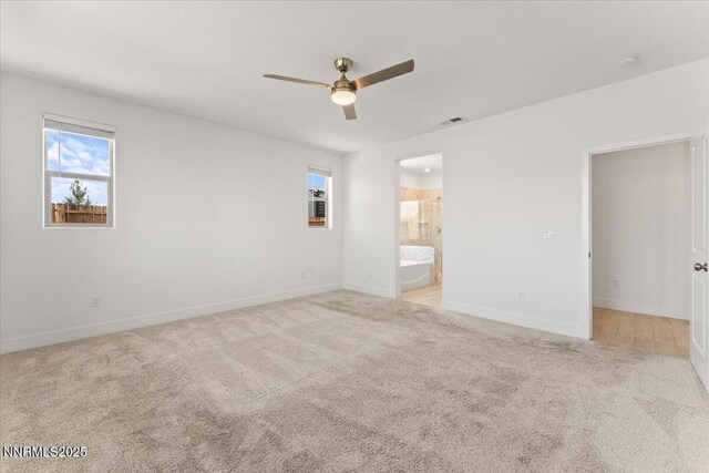 2251 Slater Mill Dr, Sparks, NV 89441 - unfurnished bedroom with carpet, ensuite bath, and ceiling fan