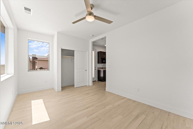 2251 Slater Mill Dr, Sparks, NV 89441 - unfurnished bedroom with light wood-style flooring, a closet, and a ceiling fan