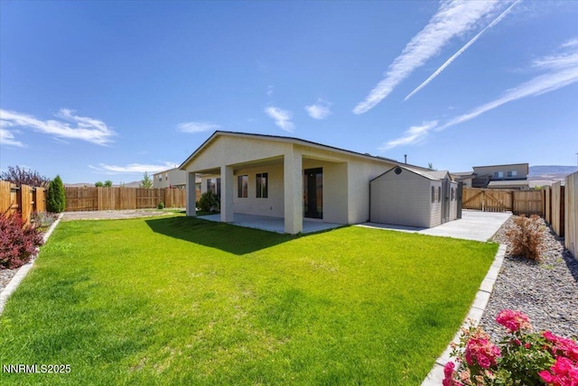 2251 Slater Mill Dr, Sparks, NV 89441 - back of property with a patio area, stucco siding, and a fenced backyard