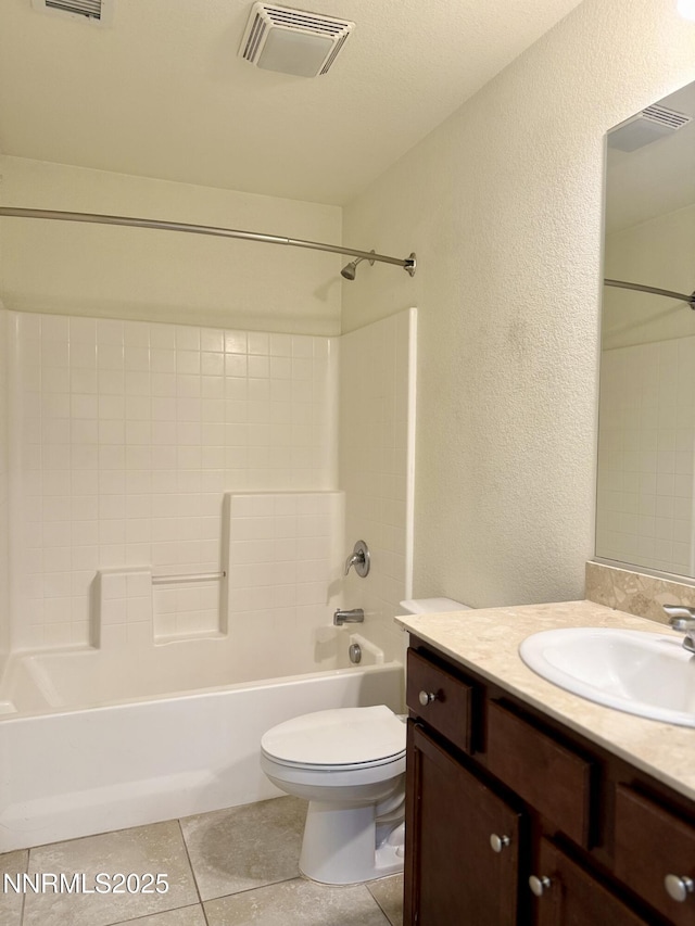 1122 Ferretto Pkwy, Dayton, NV 89403 - bathroom featuring a textured wall, vanity, shower / bathtub combination, and tile patterned flooring